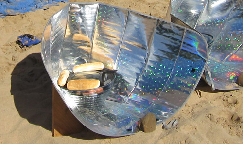 Solar funnel cooker with hot dogs