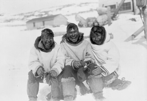 Three Inuit men (L to R: Lucas, Bobbie and Johnnie) posing for a photograph outside, Port Burwell, Nunavut / Trois Inuits (de gauche à droite : Lucas, Bobbie et Johnnie) prennent la pose dehors pour un photographe, Port Burwell (Nunavut)