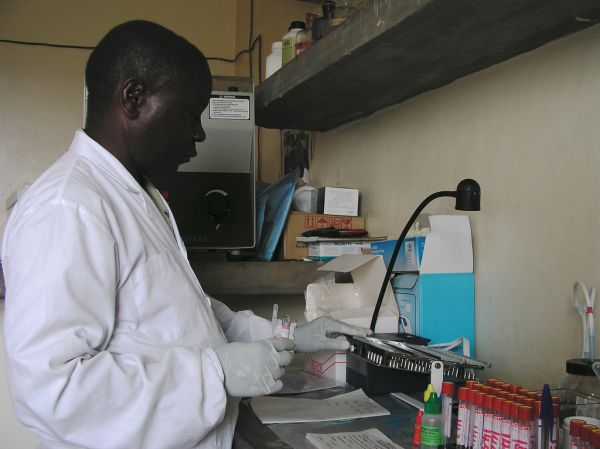 A laboratory technician conducts an HIV test