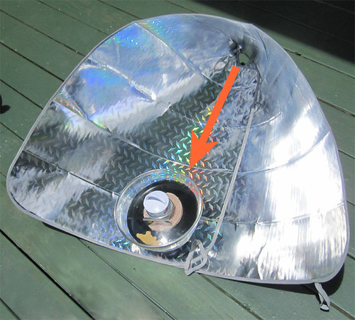 The solar funnel cooker in position for overhead sun