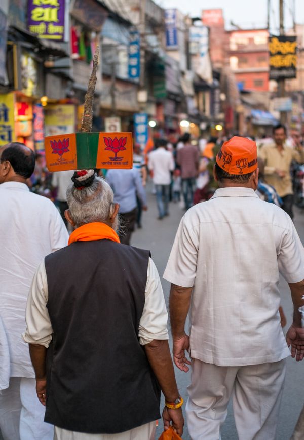 6am: supporters of Narendra Modi gathering at Varanasi wearing orange caps