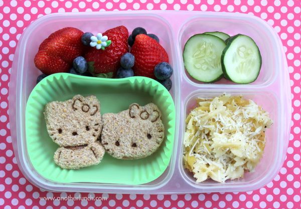 Hello Kitty sandwiches, parm pasta, berries, cucumbers in EasyLunchboxes bento lunch