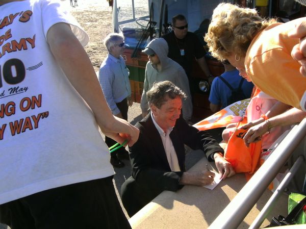 BBC News Man signs autographs