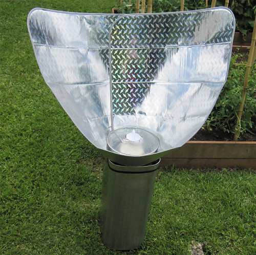 Solar funnel cooker with diamond plate car window shade