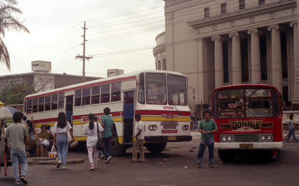 23739 (248) 11-03-1990 Trifmann Hino DVS-762 (fleet No 41024) and Mini bus NVZ-457 in the Lawton area of Manila, Philippines.