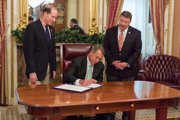 Speaker John Boehner signs H.R. 5021, The Highway and Transportation Funding Act., sponsored by Rep. Dave Camp (R-MI) and co-sponsored by Transportation and Infrastructure Committee Chairman Bill Shuster (R-PA).