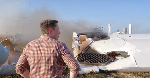 Elon Musk overlooking the remains of F9R