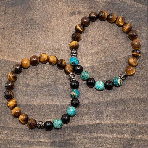 A customer of mine wanted a bracelet for a friend who was going through thyroid cancer treatment, so I thought about what I could do and then I had the idea of a complementary pair for her and her partner. Tiger eye symbolizes and promotes strength, black