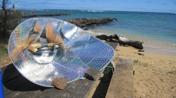 Solar funnel cooker with hot dogs
