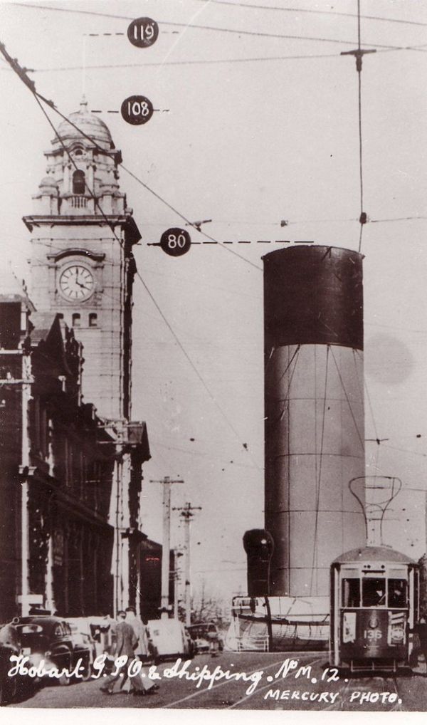 THINKING ABOUT FUNNELS. The funnel of the Ocean Steamship Company's S.S. NESTOR compared to Hobart GPO. Photo Hobart 'Mercury.'