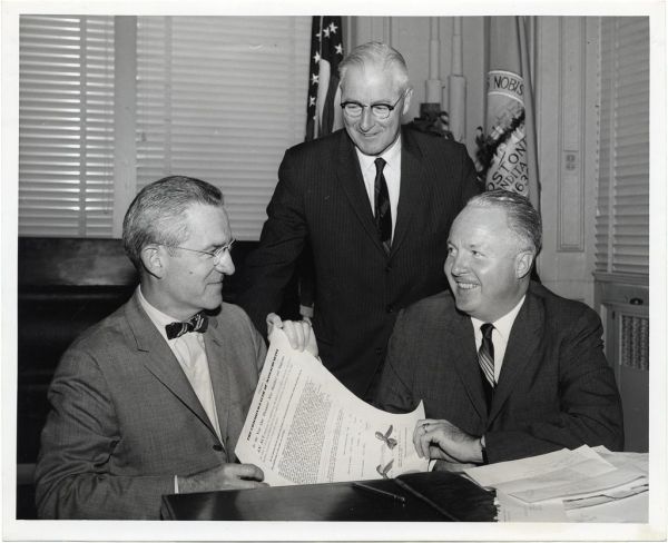 Robert S. Kretshmar, Executive Secretary of AAA's Massachusetts Division; Commissioner Thomas F. Carty, Boston Traffic Department; and Mayor John F. Collins celebrate jaywalking legislation