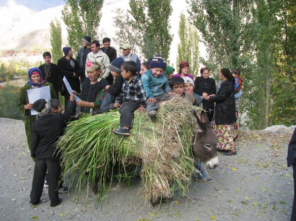 School children review mine risk hand outs in Tajikistan