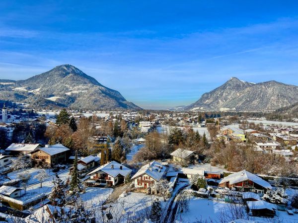 Winter in the river Inn valley with Wildbarren mountain (left) and Kranzhorn mountain seen from Oberaudorf in Bavaria, Germany