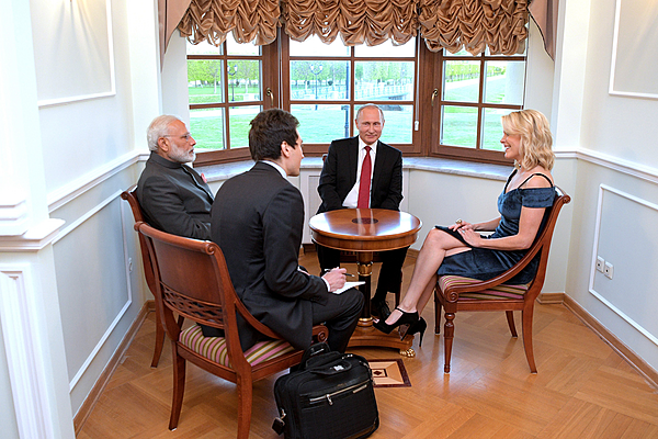 Prime Minister Narendra Modi and President Vladimir Putin meeting with Megyn Kelly, NBC News anchor and moderator of the St Petersburg International Economic Forum plenary session