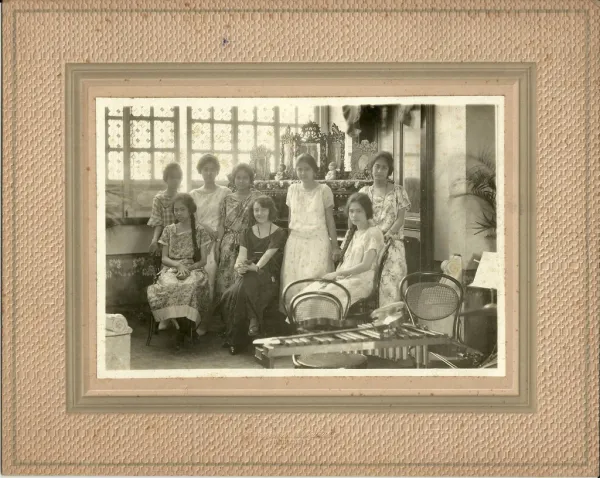 Young western lady, possibly a music teacher, with group of girls, by Casanave Art Studio, Iloilo, Philippines