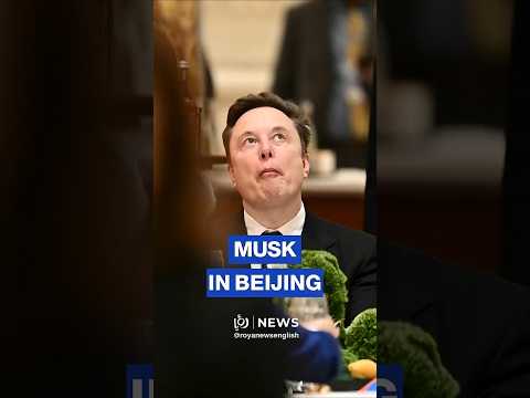 Elon Musk makes faces next to Apple’s Tim Cook in Beijing