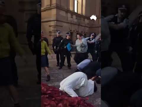 Police remove Muslim group praying during Sydney protest