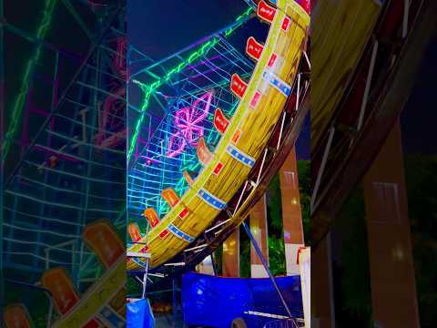 🌊 Feel the thrill of the Kora-Kora swing ride as it soars to the sky!