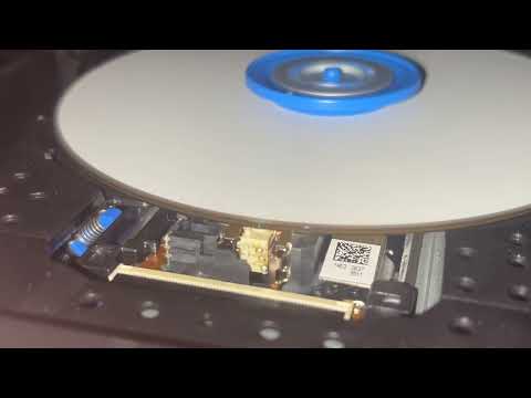 upclose and slow motion view of laser burning a 128GB BDXL disc